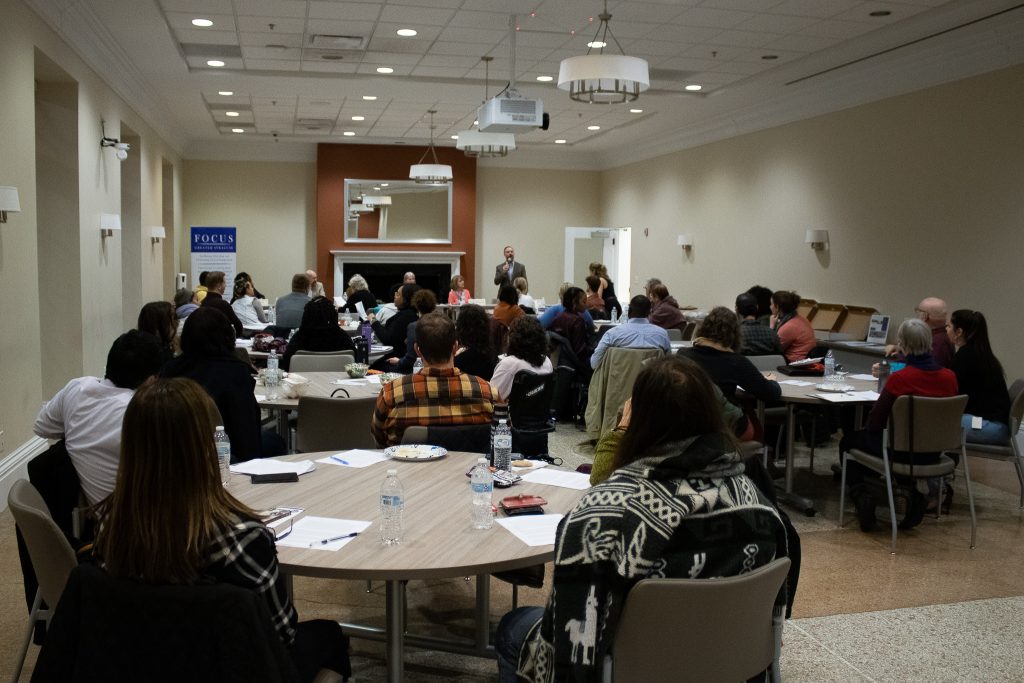 A photo of the Syracuse FOCUS event in February 2023 in session.