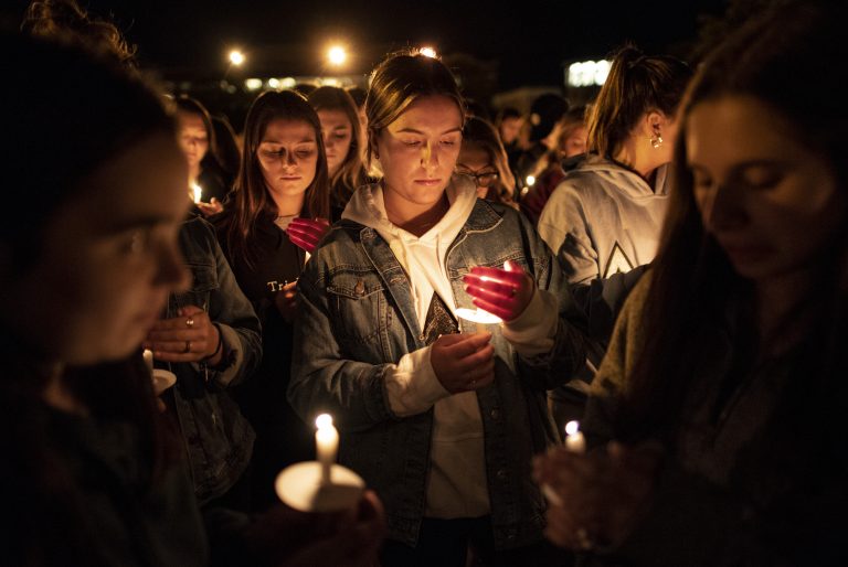 Gianna Prudente holds a candle at the Safe Driving Vigil sponsored by both Phi Kappa Psi and Delta Delta Delta Monday evening outside Hendricks Chapel.