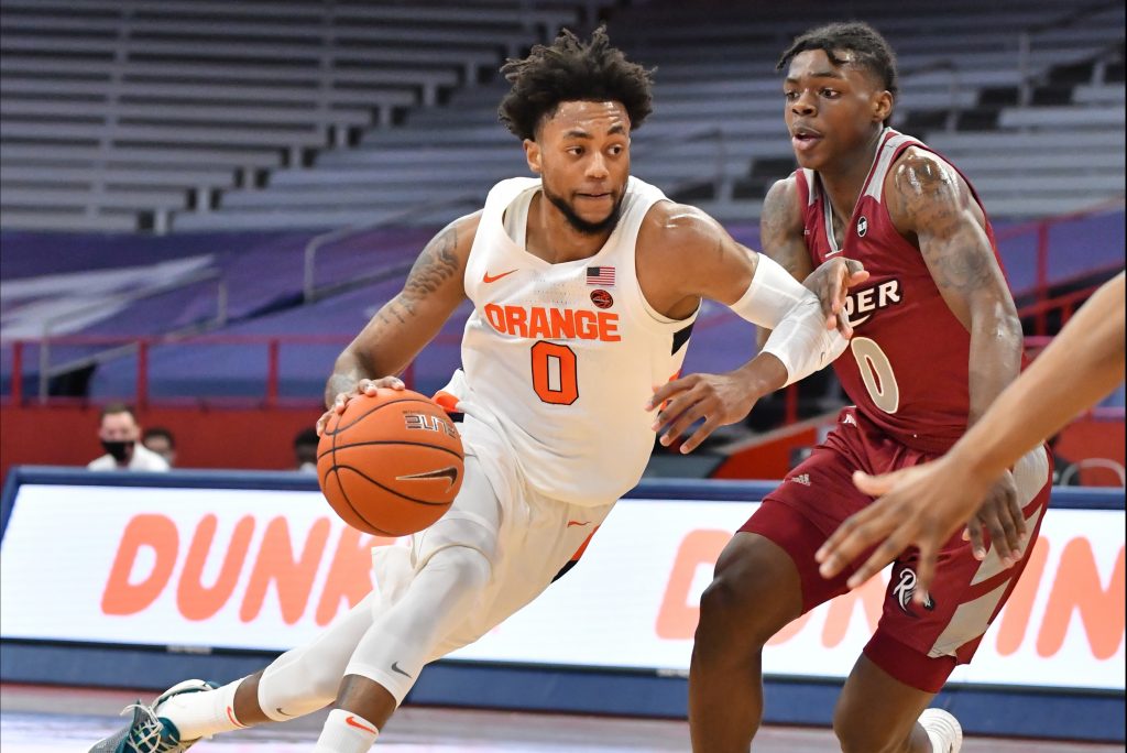 Dec 5, 2020; Syracuse, New York, USA; Syracuse Orange forward Alan Griffin (left) drives to the basket as Rider Broncs guard Christian Ings (right) defends in the first half at the Carrier Dome. Mandatory Credit: Mark Konezny-USA TODAY Sports