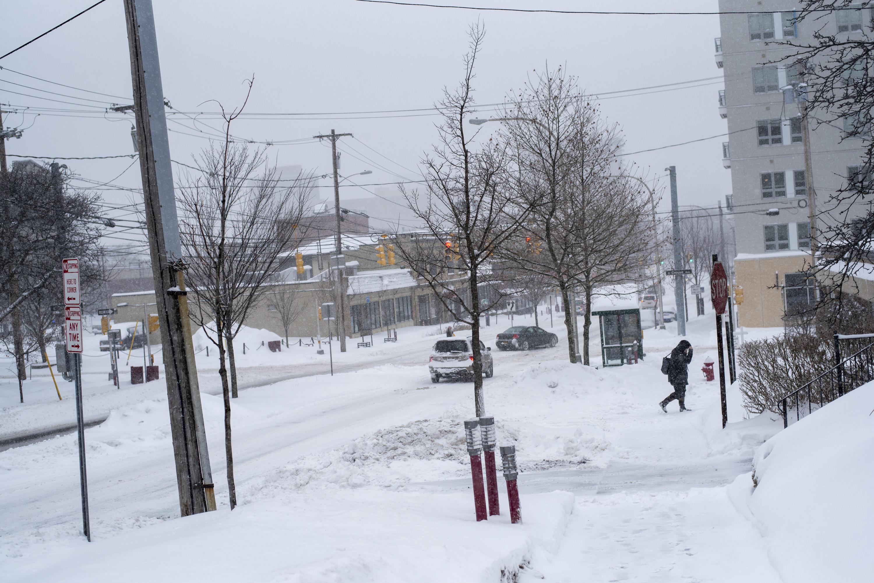 Syracuse University canceled Friday clases as more than a foot of snow was burying Syracuse.