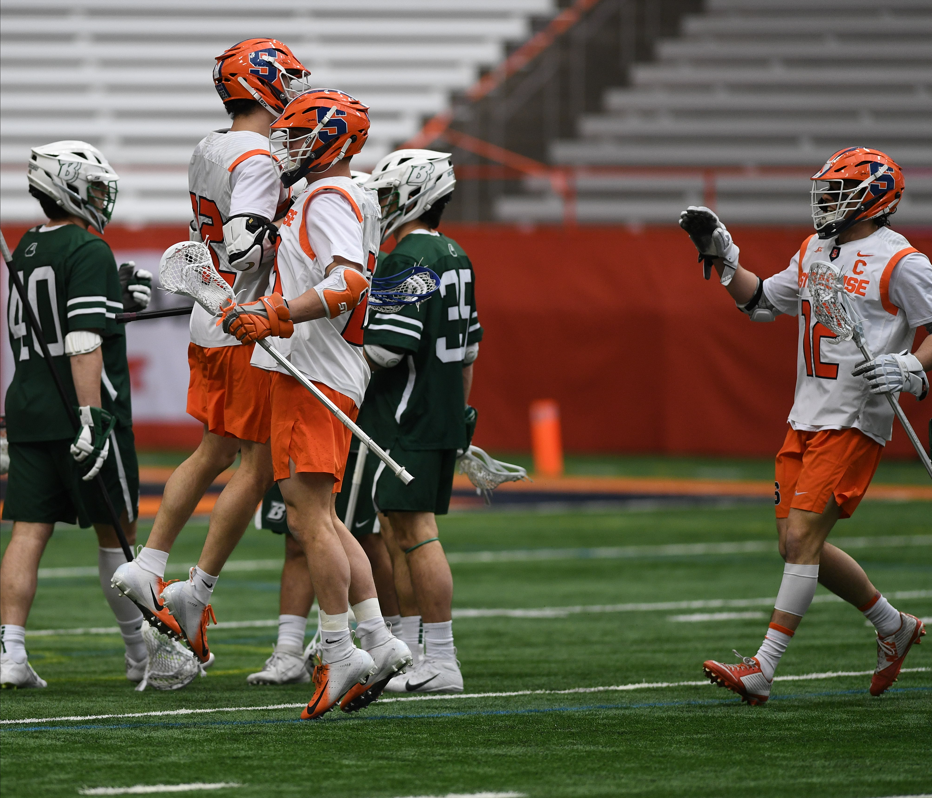 Chase Scanlan and Tucker Dordevic celebrate after Scanlan scored in the first period of the game