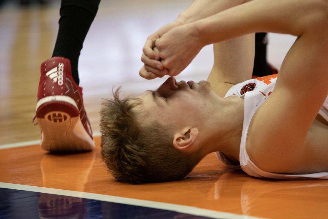 Marek Dolezaj takes a second to breathe after a fall while shooting during Syracuse Men's Basketball's Feb. 11 game vs. NC State Wolfpack in the Carrier Dome.
