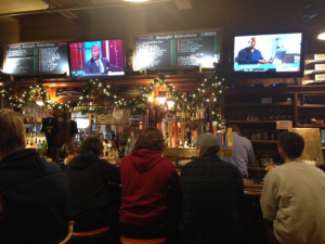 Customers talk and await their drinks at Faegan’s Pub.