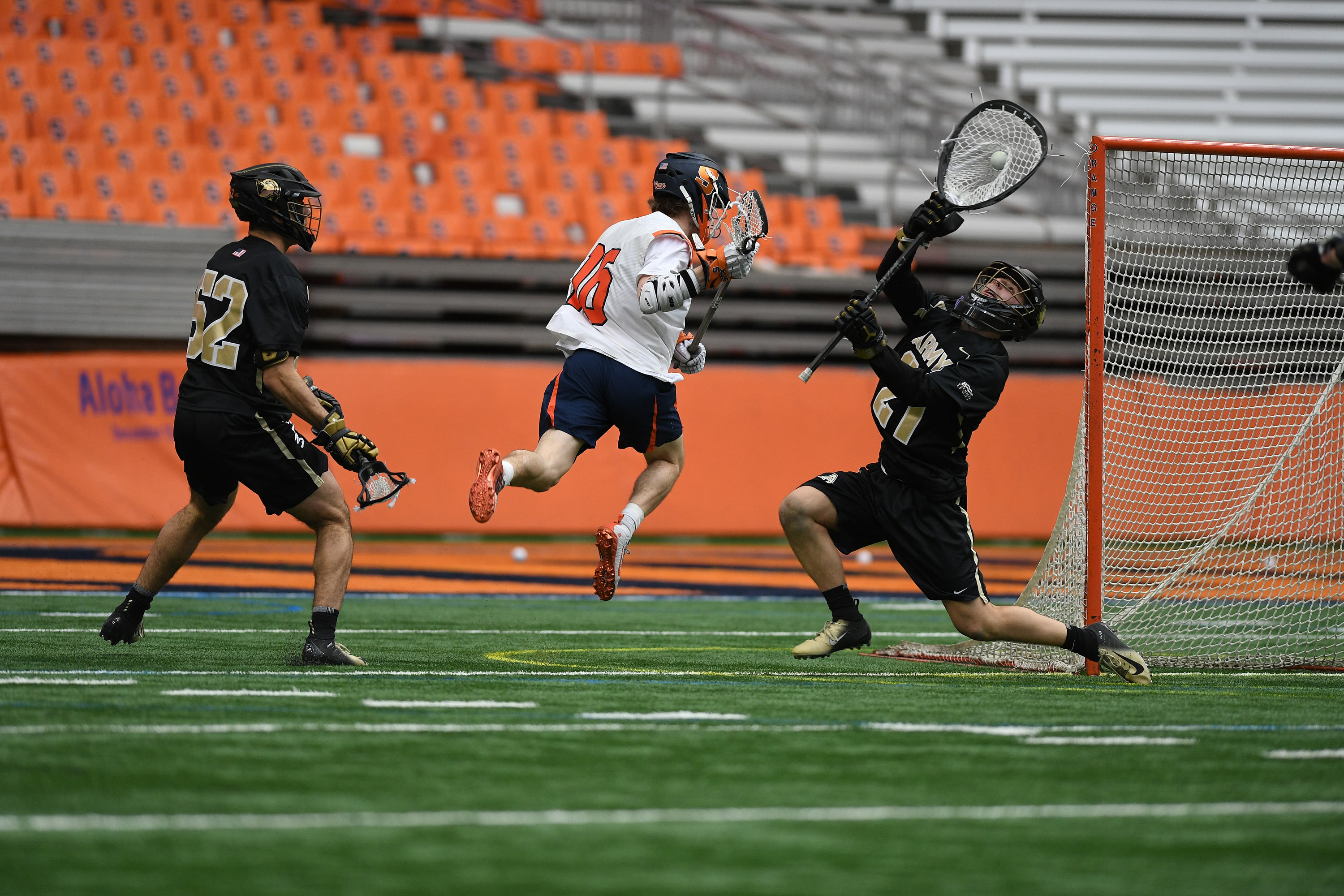 Army goalie Wyatt Schupler saves a shot by Syracuse’s Brendan Curry during the game at the Carrier Dome on Feb. 23, 2020.
