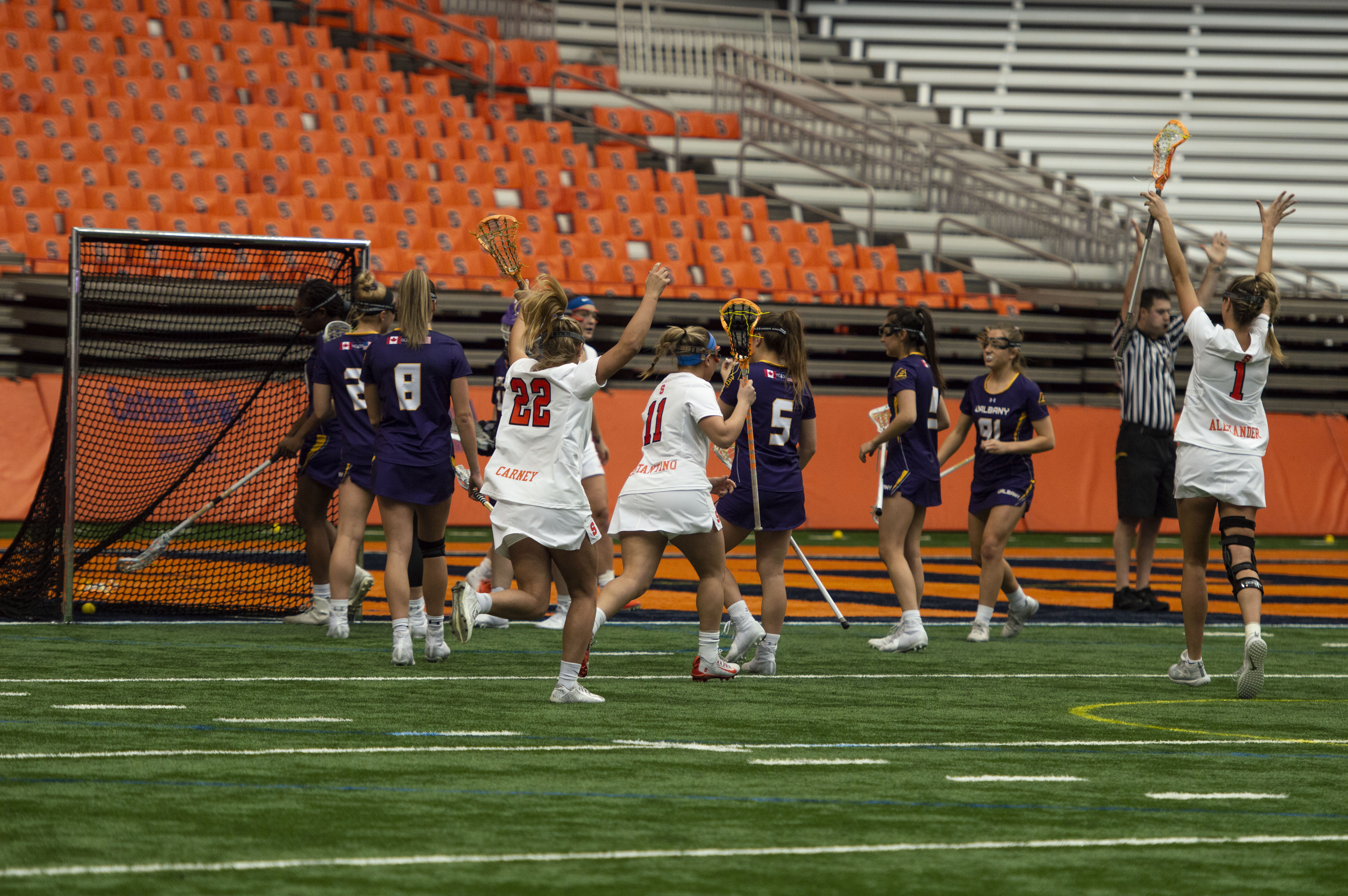 The Syracuse Women’s Lacrosse team celebrate after a goal during Saturday's game vs. Albany in the Carrier Dome.