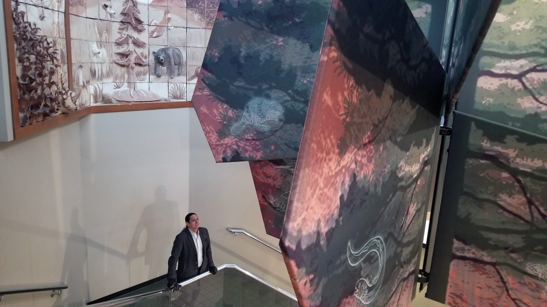 Powless looks out over the atrium of the Skä•noñh Center under the Great Tree of Peace, on two branches of which are printed designs of the eel and the beaver, symbols respectively of Powless and his father’s clans (which are passed down through the mother).