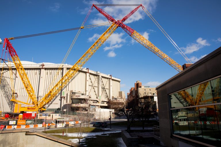Cranes outside the Carrier Dome on Sunday March 1, 2020, during the last live event for the roof and renovation projects.