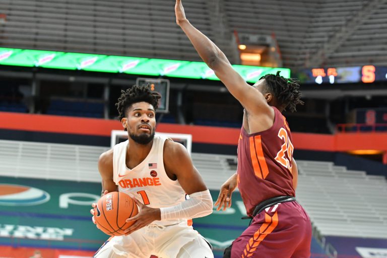 Jan 23, 2021; Syracuse, New York, USA; Syracuse Orange forward Quincy Guerrier (1) tries to move past Virginia Tech Hokies forward Justyn Mutts (25) in the first half at the Carrier Dome. Mandatory Credit: Mark Konezny-USA TODAY Sports