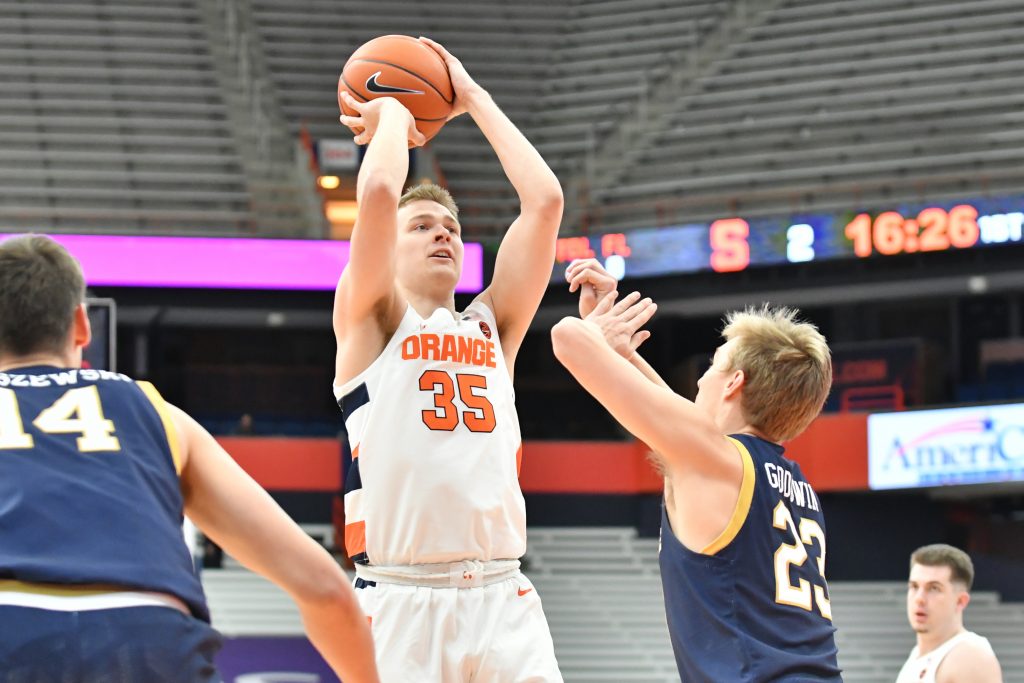 Syracuse Orange guard Buddy Boeheim (35) takes a shot over Notre Dame Fighting Irish guard Dane Goodwin (23) in the first half at the Carrier Dome.