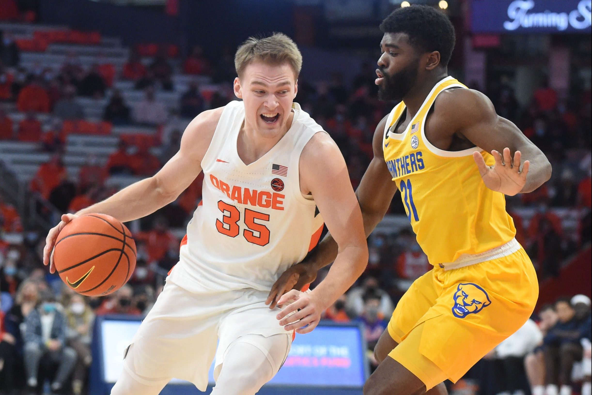 Syracuse Orange guard Buddy Boeheim (35) drives on Pittsburgh Panthers guard Onyebuchi Ezeakudo (31). The Syracuse Orange take on the Pitt Panthers Jan. 11, 2022 at the Carrier Dome in Syracuse, N.Y.Dennis Nett | dnett@syracuse.com