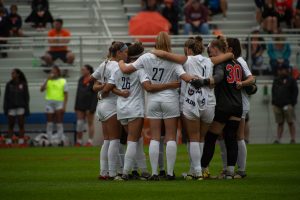 The Syracuse Women’s Soccer team huddles before their match against Cornell University on September 11, 2022. Syracuse finished the game winning 3 to 0.
