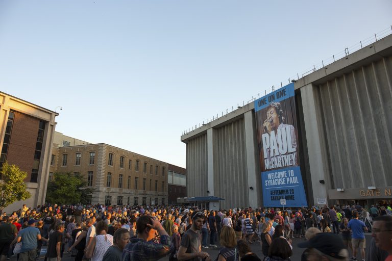 The Dome with a large Paul McCartney banner and lots of fans waiting outside.