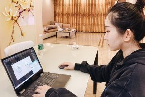 Rebecca Jin at laptop