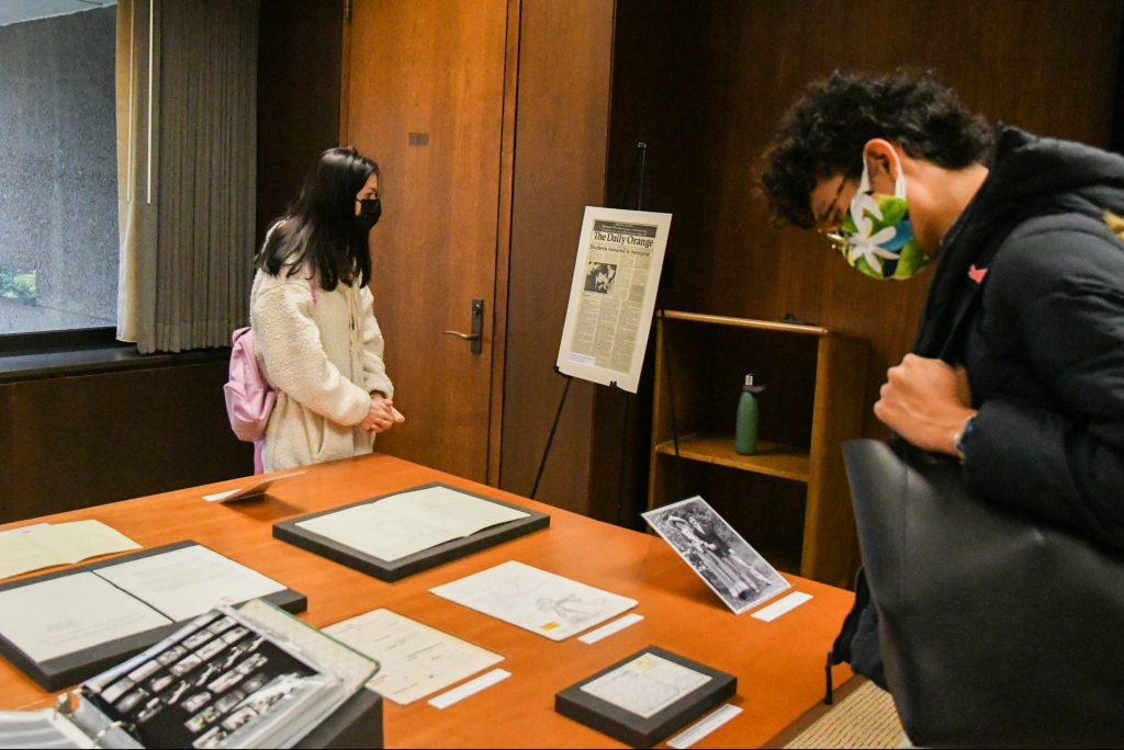Syracuse University students Megan Rienzo and Kaai I take a look at the archives from the Pan Am Flight 103/Lockerbie Air Disaster Archives Pop-Up Exhibition on Friday, October 22, 2021.