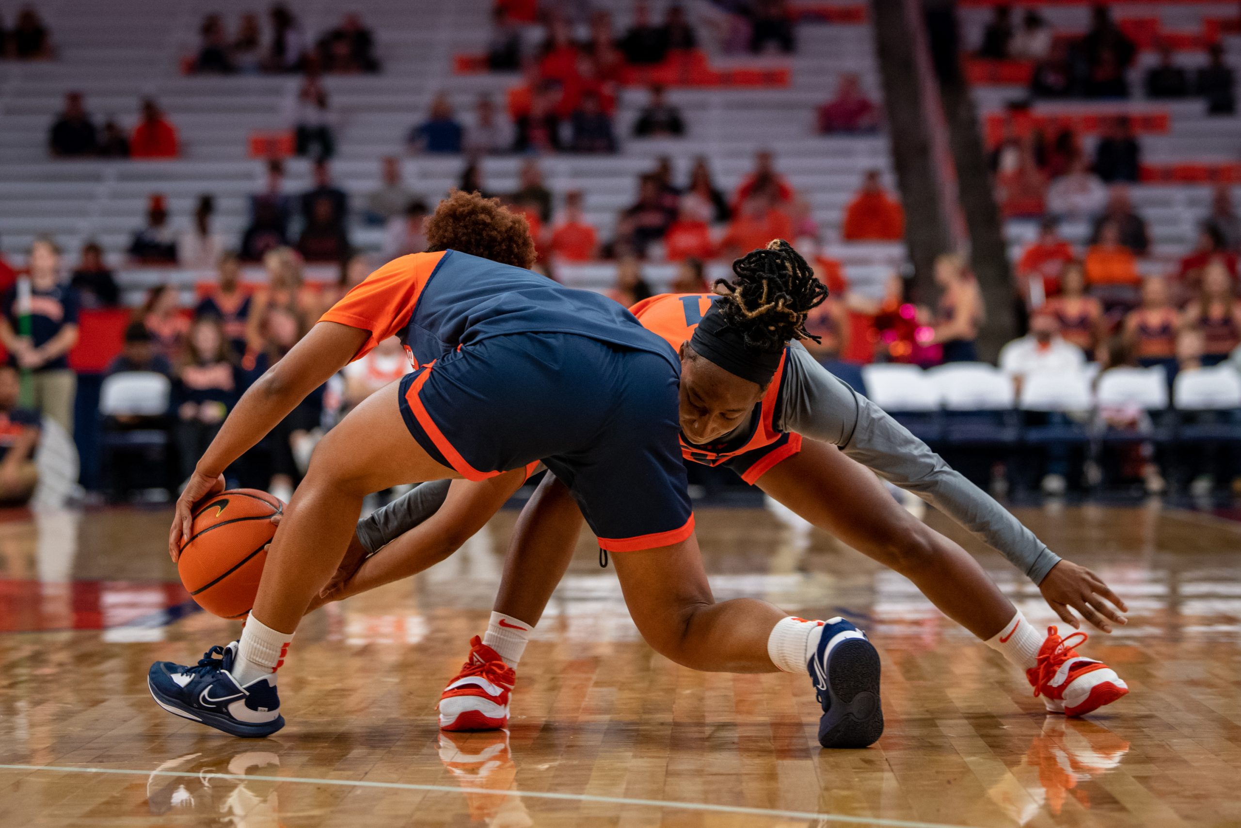 Freshman guard, Lexi McNabb, tries to steal the ball from Kennedi Perkins during the women's basketball scrimmage, at the Orange Tip Off fan event. Photo by Ryan Brady. 10/14/22