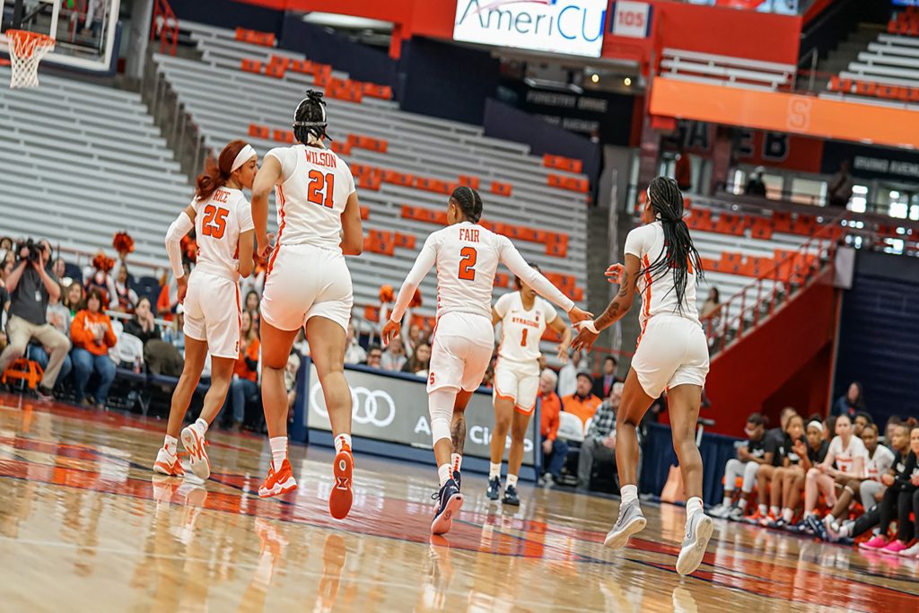 Dyaisha Fair(#2) and the Syracuse Orange after she scores her 2500th career point against Boston College