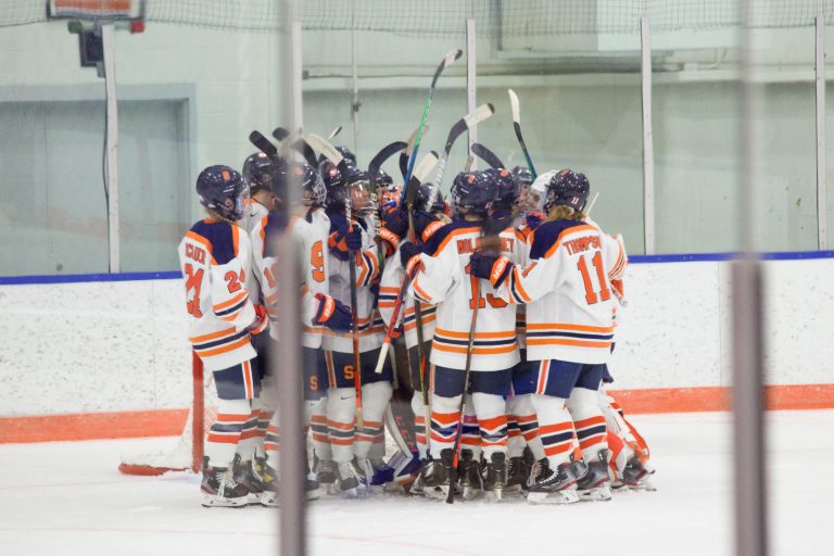 The Syracuse women's ice hockey team celebrates their 4-2 victory over Penn State on Dec. 12, 2020.