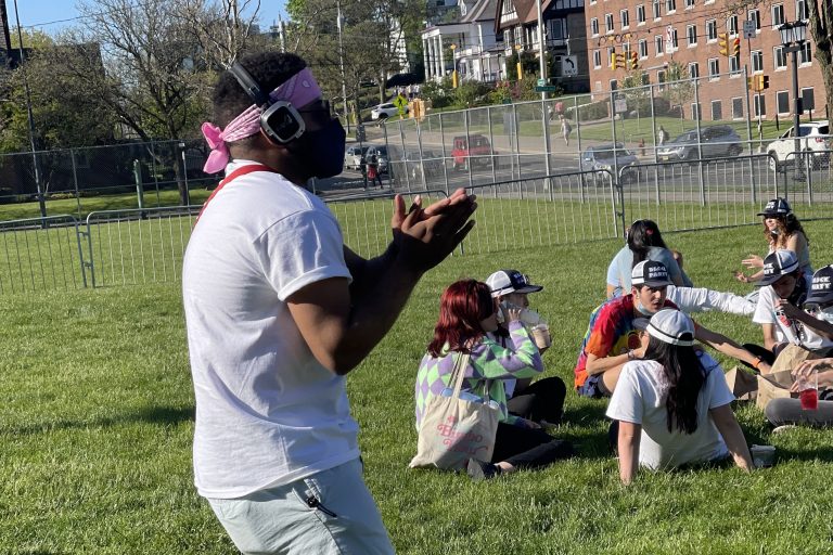 Silent Disco dancer outside SU's Women's Building at Block Party 2021