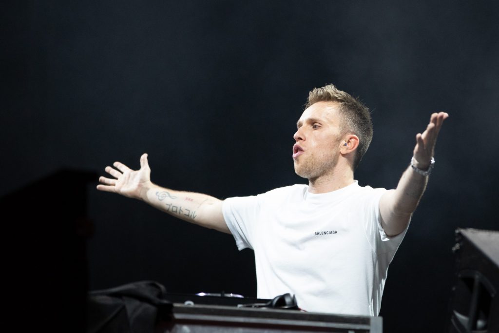 Headliner Nicky Romero, a dutch DJ, raises his hand while performing on stage during the Dandelion Music Festival in Clinton Square in Downtown Syracuse, NY on October 2, 2021.