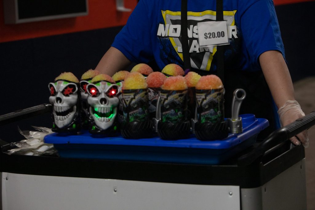 A vendor sells water ice in Monster Jam cups on Saturday night at The Dome.