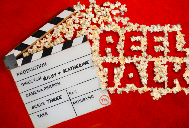 Popcorn spells out "Reel Talk" next to a film clapper.