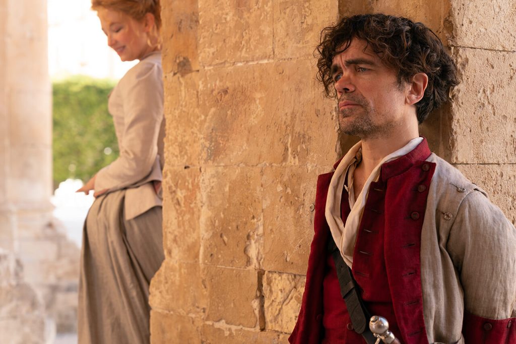 Peter Dinklage as Cyrano talks to Roxanne, played by Haley Bennett.