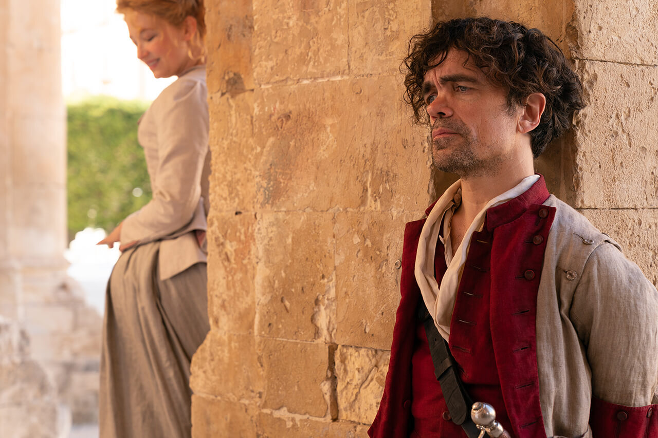 Peter Dinklage as Cyrano talks to Roxanne, played by Haley Bennett.