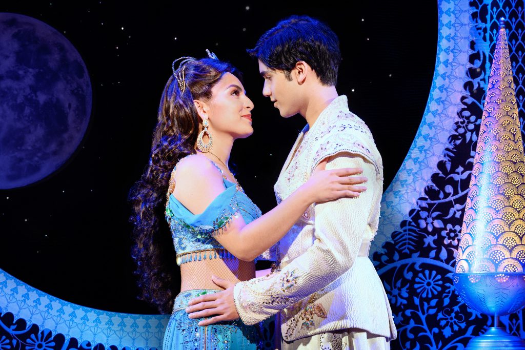 Senzel Ahmady (Jasmine) and Adi Roy (Aladdin) embrace in the touring production of 