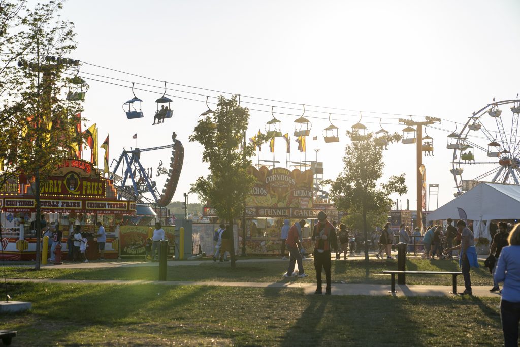 Busy night as the sun begins to set over the New York State Fair on Sunday August 27, 2023. Photo by Matt Hofmann