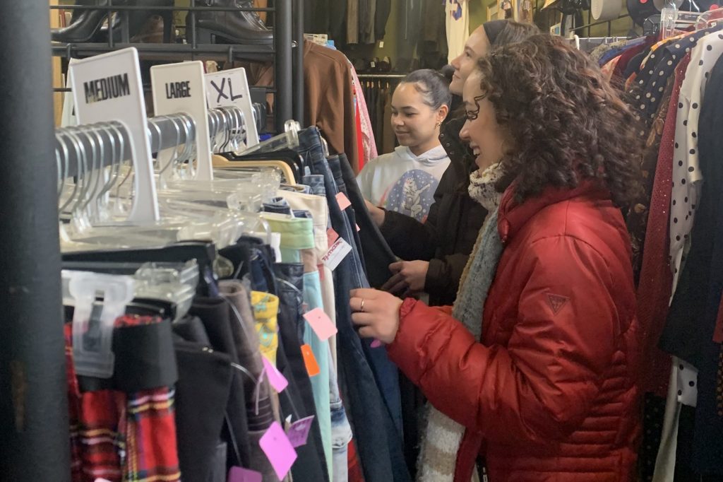 College students thrift shopping in Syracuse