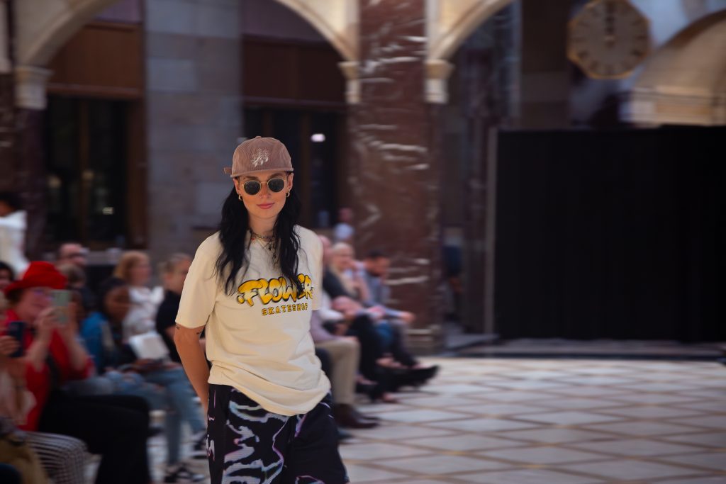Effortlessly cool, Flowers Skate Shop turns heads as models walk — and skate — down the runway in ‘90s streetwear-inspired fits.