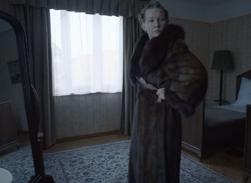 Sandra Huller as Hedwig Hoss trying-on a fur coat in the zone of interest