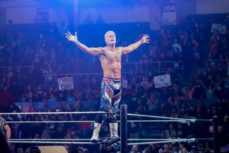 Cody Rhodes celebrates with the audience after his match at the WWE Road To WrestleMania show in the Oncenter Arena on Sunday.