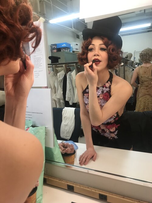 Kayla King getting ready for a performance