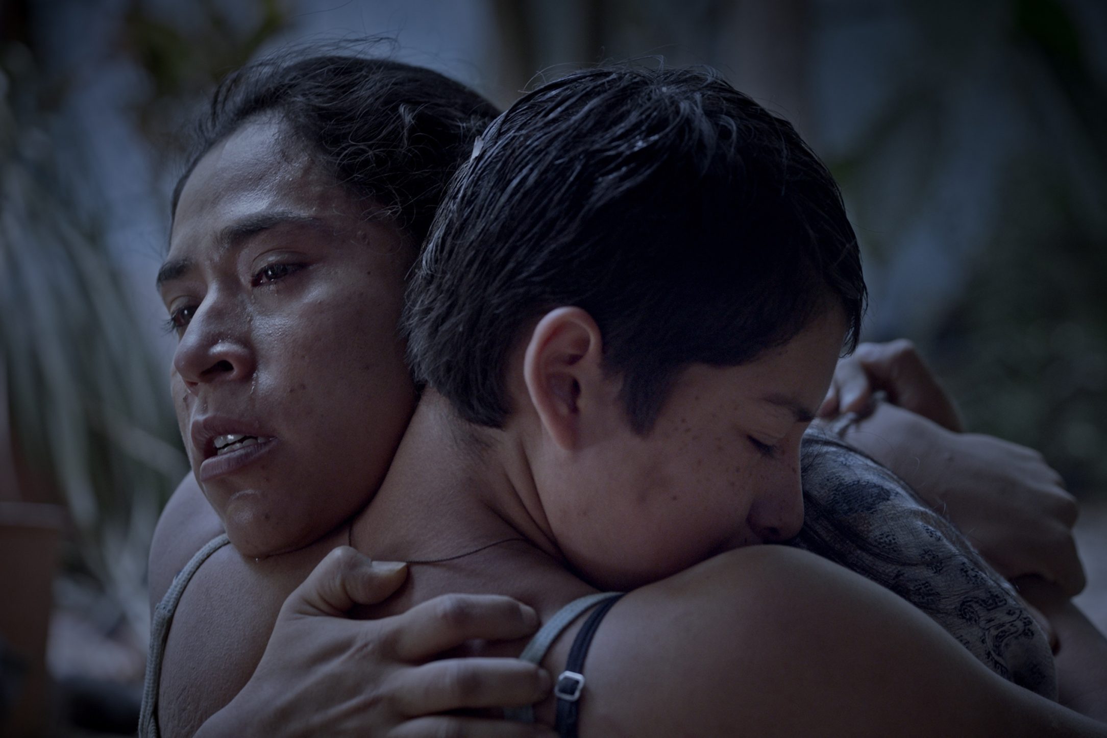 Characters Rita and Ana hug in the film Prayers for the Stolen