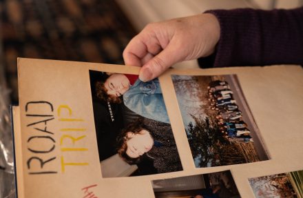 Alumni of Kappa Alpha Theta sorority flip through old photo albums