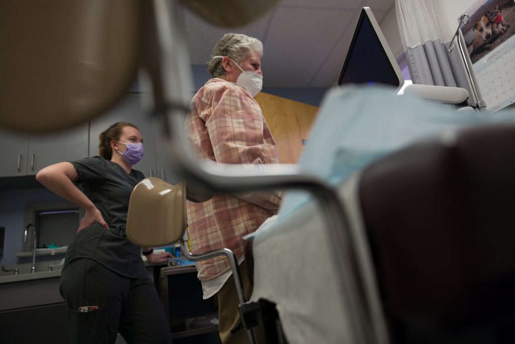 Ellen Armstrong and Peg Johnston, who both work at Southern Tier Women's Health Services, gear up the sonogram in preparation for an abortion.