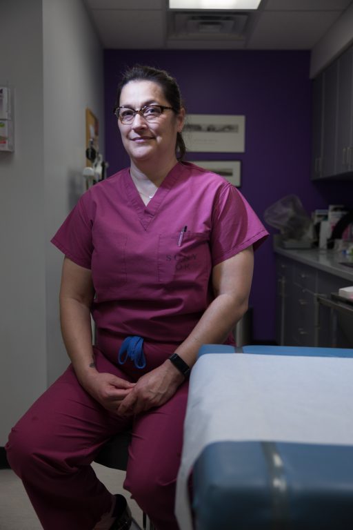 Renee Mestad poses for portrait inside clinic