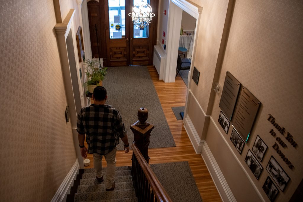 Chris Kosakowski walks down the stairs of Vera House