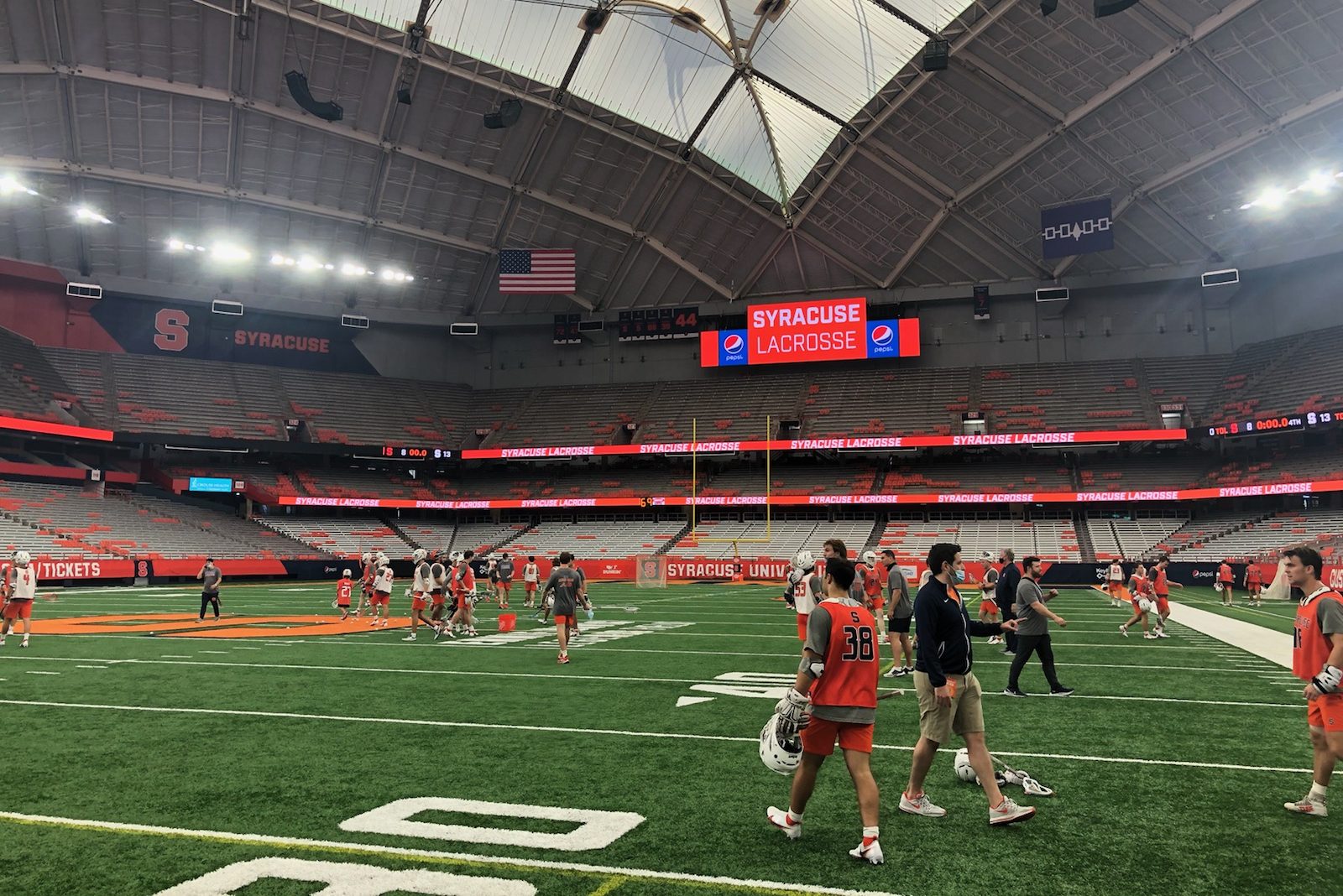 The 2022 Syracuse men's lacrosse team watches Orange alumni play in a friendly game on Saturday in the Dome.