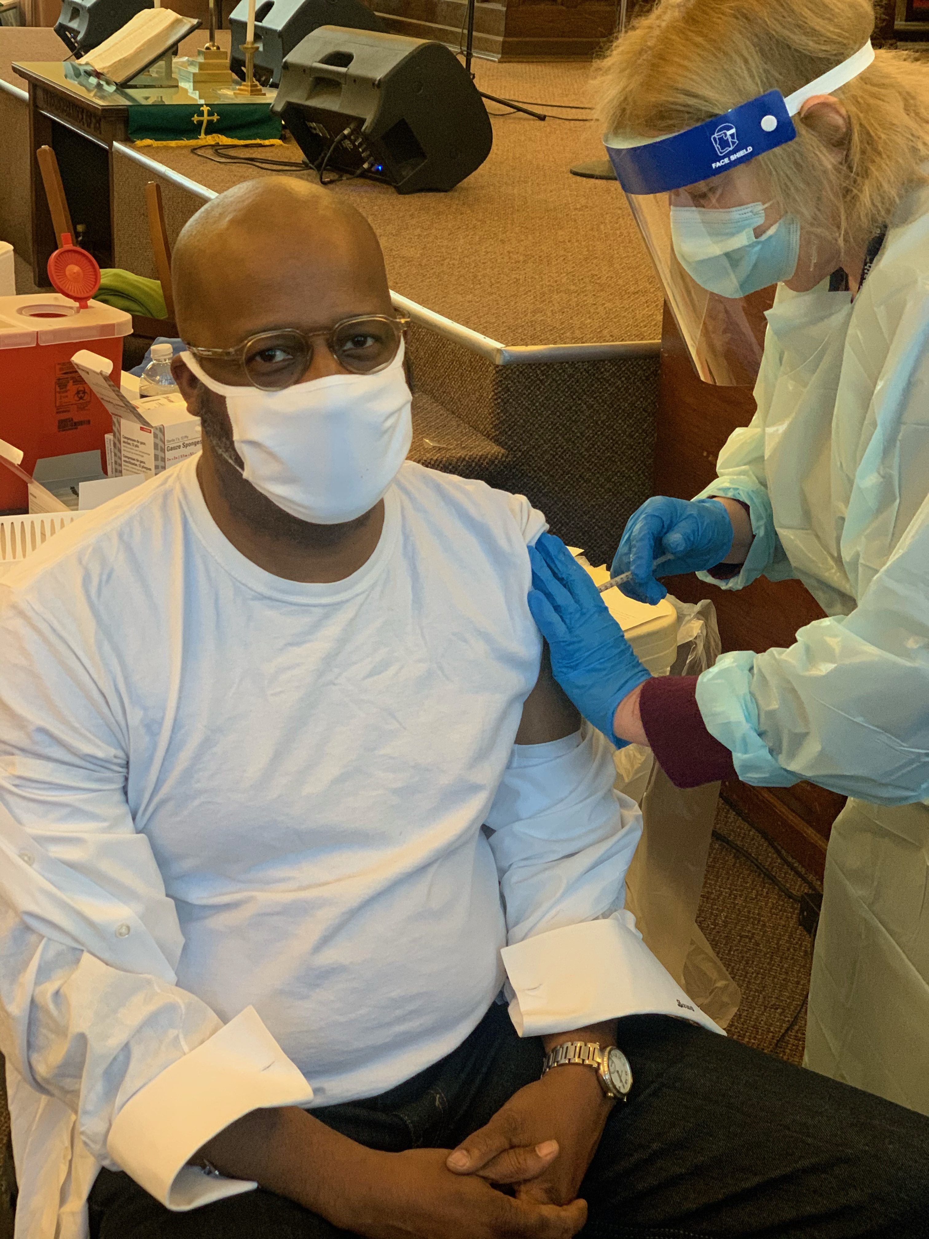 Pastor Daren Jaime of People’s AME Zion Church on Syracuse’s South Side receives his first dose of the COVID-19 vaccine at the church’s vaccination site on January 25, 2021.