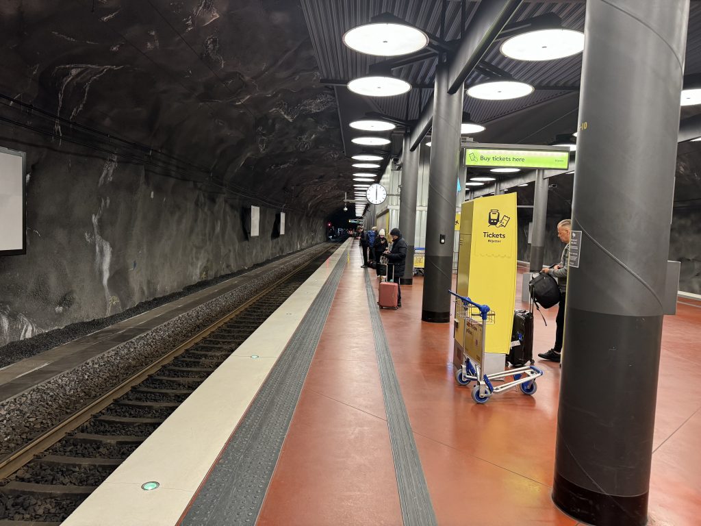 Travelers wait for Stockholm’s Arlanda Express on the subway platform