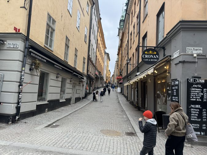 Pedestrians walk the street of Västerlånggatan in Stockholm, Sweden