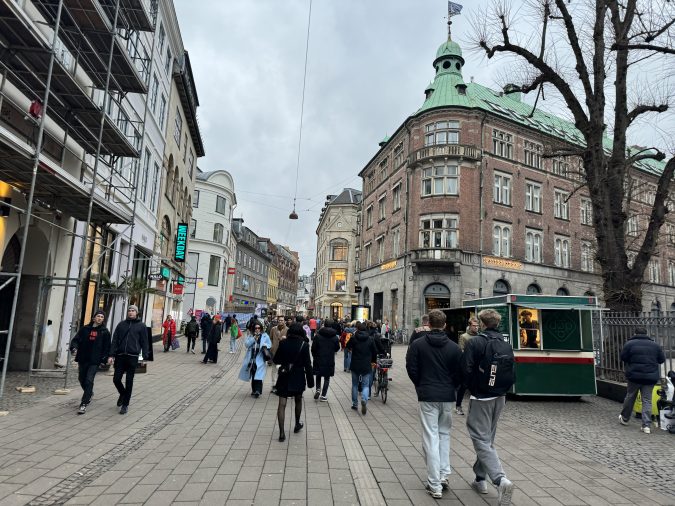 Pedestrians walk the streets of the Strøget shopping area in Copenhagen, Denmark