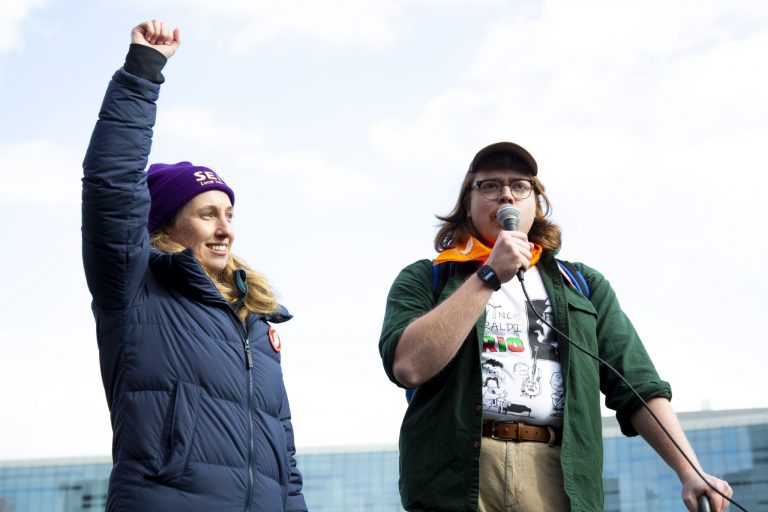 Hayden Courtney, a PhD student and TA in Maxwell, rallies the graduate student employees to form a recognized union in their March of Recognition on Wednesday Feburary 8, 2023. (Photo by Joohee Na)