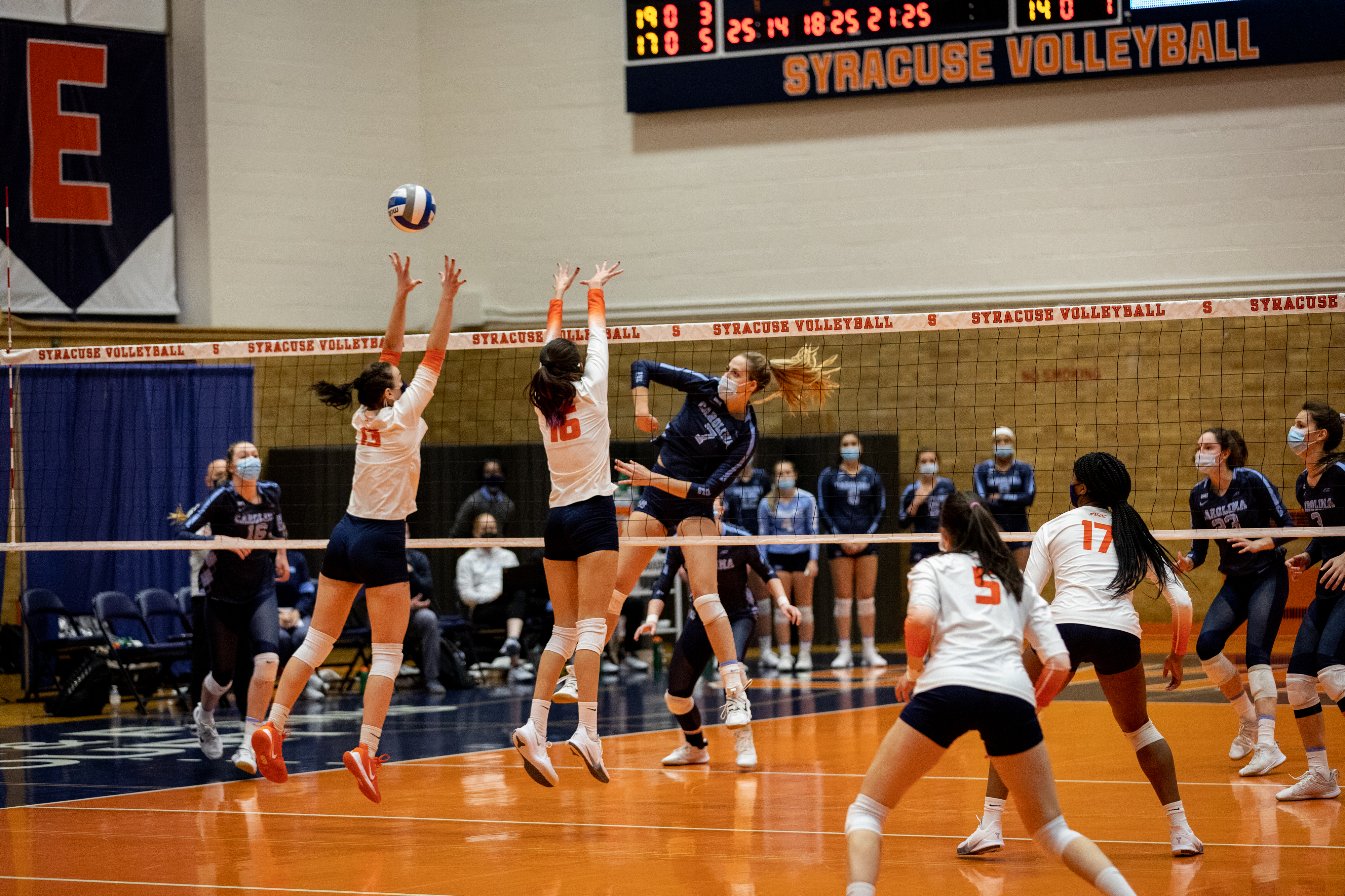 SU's Yuliia Yastrub (13) and Abby Casiano (16) block a spike during the March 5, 2021 game against UNC in the Women's Building in Syracuse, NY.