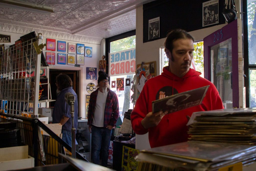 (From left to right) Herb Miller, Tom Little, and Ronnie Dark stand inside Syracuse Vintage Vinyl in SYracuse, New York on Sunday, November 7, 2021. (Photo by Ella Fling).