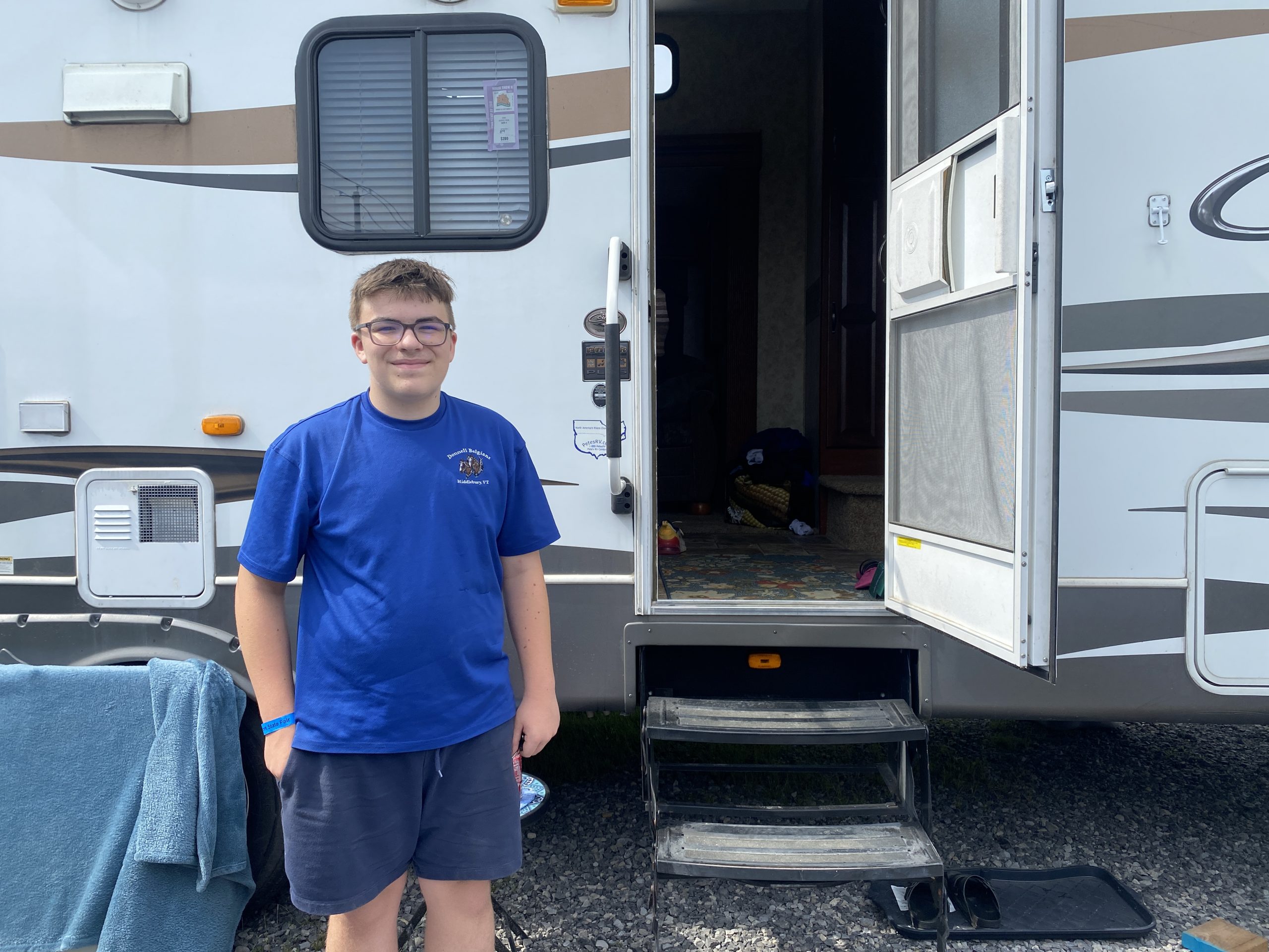 Will Deering outside his family’s RV sporting the family business uniform at the at the 2022 New York State Fair