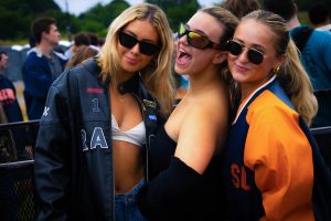 Three students wearing leather jackets at Juice Jam 2023.