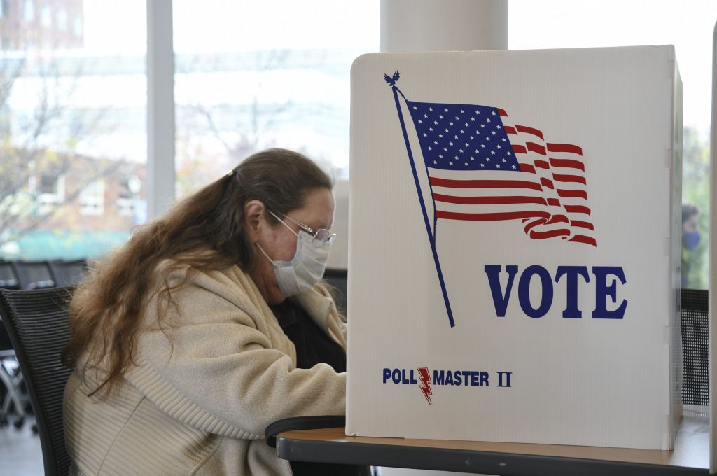 A voter at SU Huntington Hall polling station fills out her ballot.